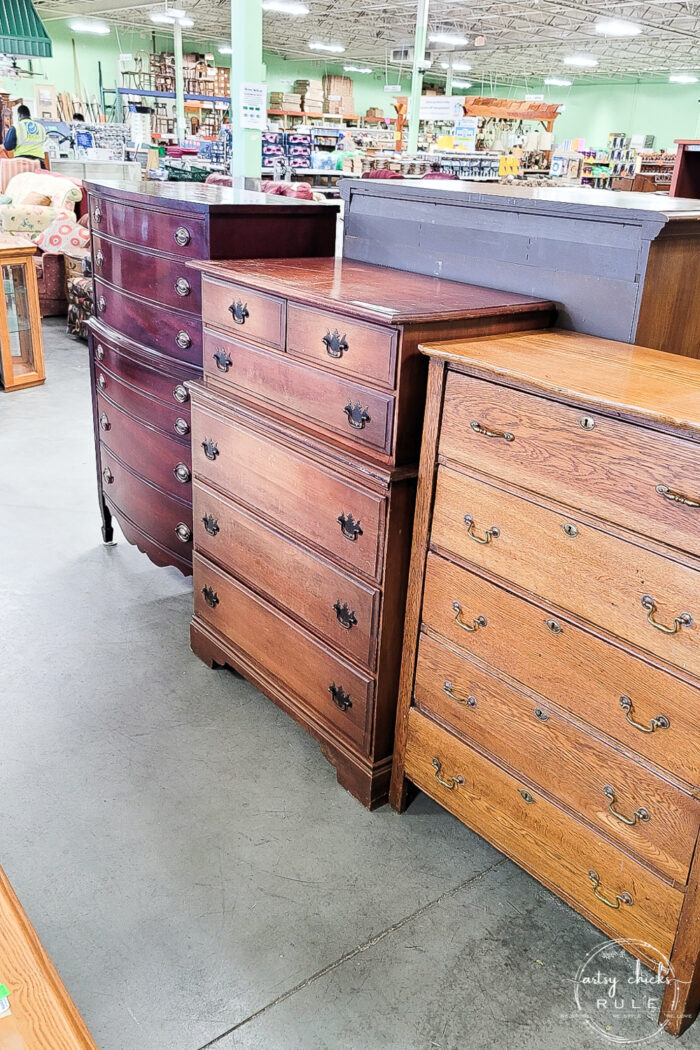 3 various colored wood stained chests