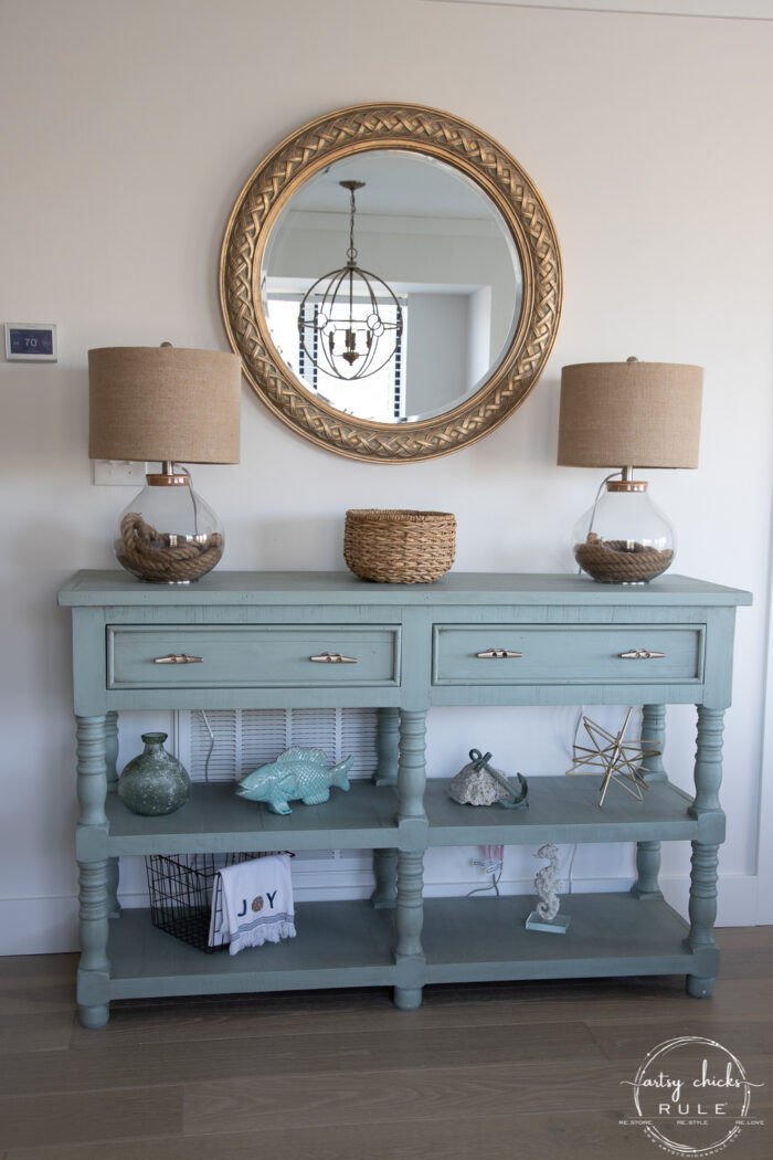 aqua console with gold round mirror