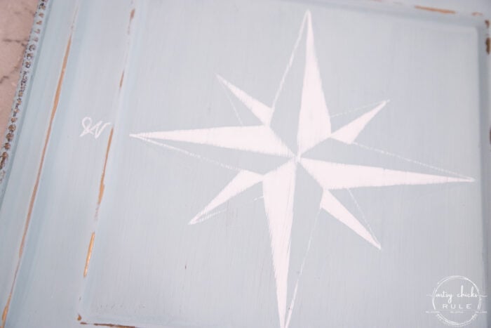 finished white compass rose on blue tray lightly sanded