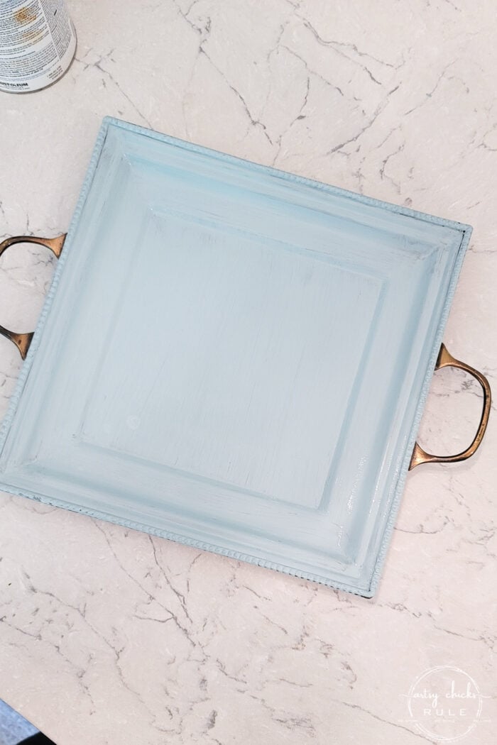 top view of blue tray with metal handles