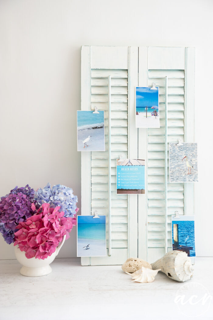 white shutter with beach photos clipped