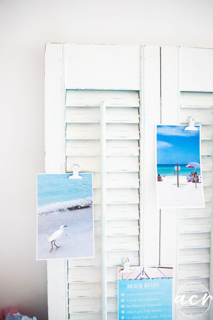 white shutters with blue water beach scene photos