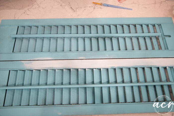 wood shutters painted aqua