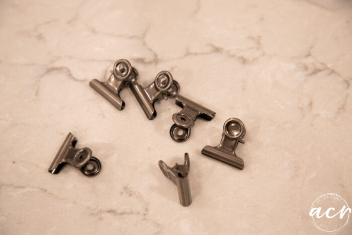 6 small bronze clips