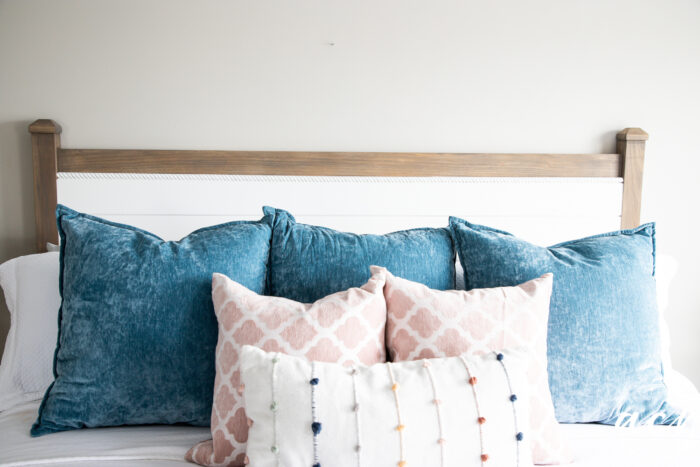 colorful pillows on white bed