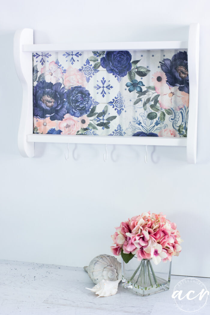 blue and pink floral white shelf on wall