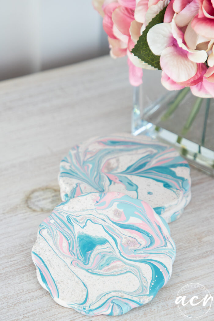 top view of pink and blue coasters with pink flowers