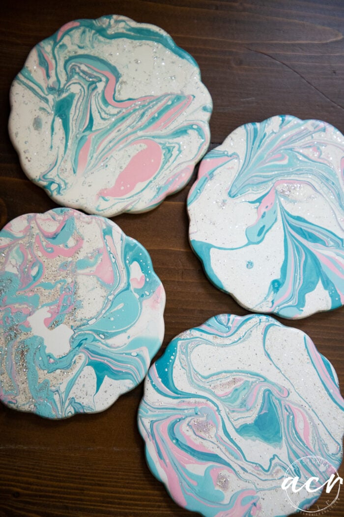 up close top view of marbled pink and blue coasters