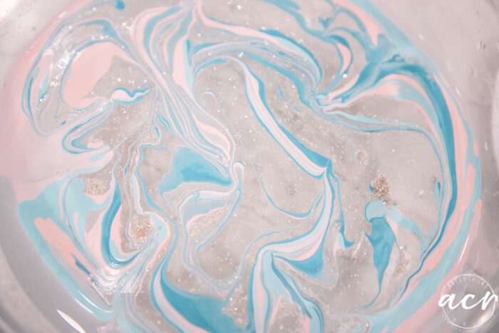 pink blue and sparkled nail polish floating bowl now swirled