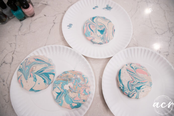 coasters marbled drying on paper plates