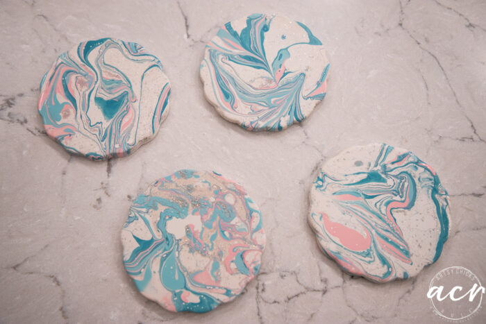 4 blue and pink coasters on counter