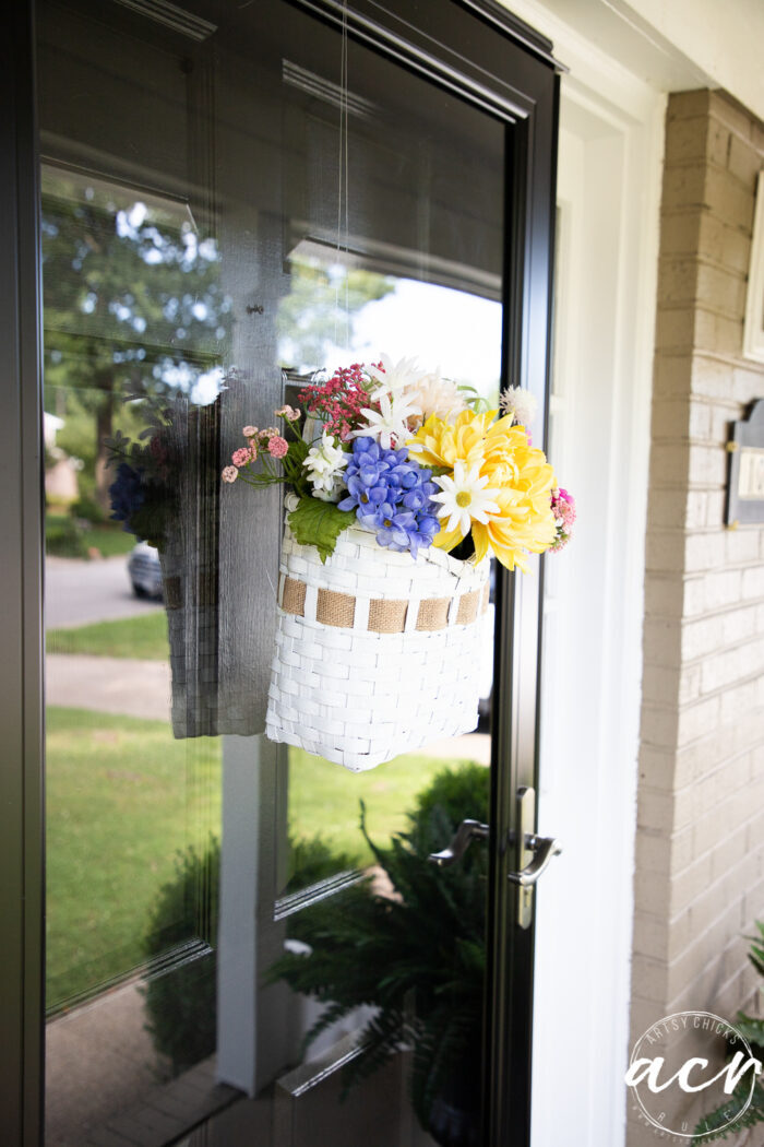 basket hanging on glass storm door