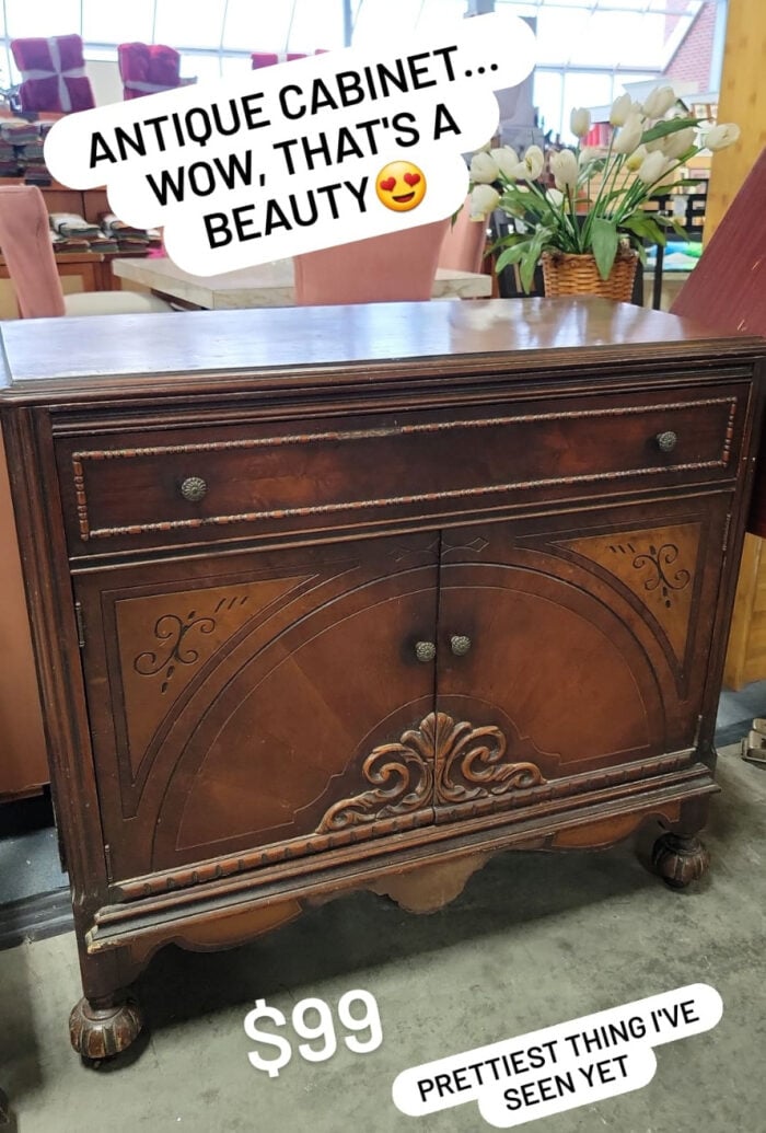 antique wood cabinet with doors and decorative trim