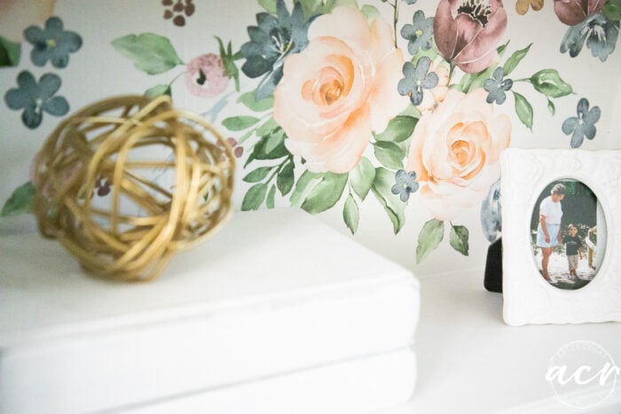 close up of white books and photograph on shelf