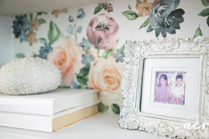 close up of white books and white framed photo