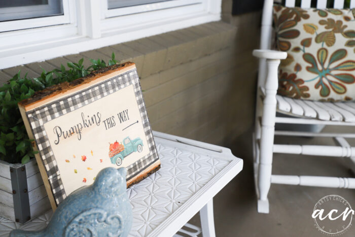 white table, blue bird and pumpkin sign