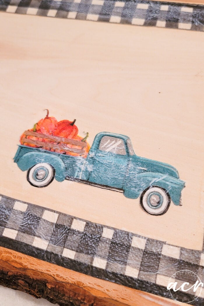 using Mod Podge to apply the blue truck