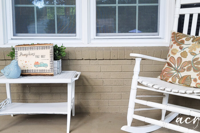 porch with white table and rocker