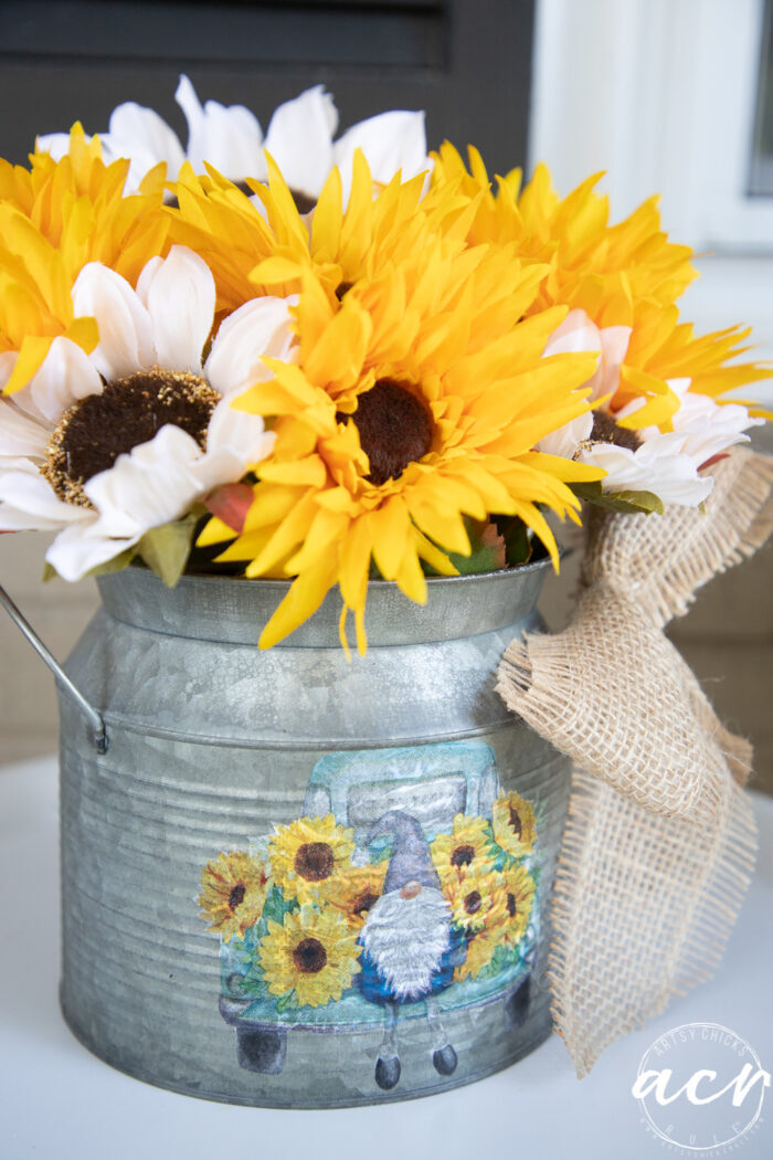 yellow and white sunflowers in metal tin with napkin decoupage gnome and truck