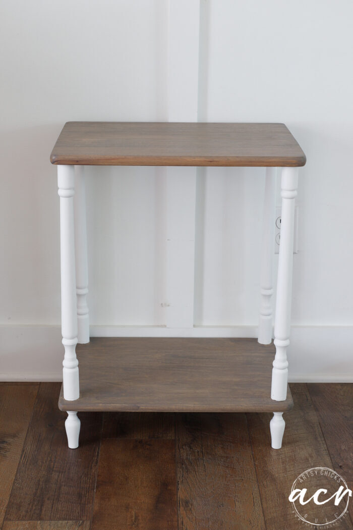 table finished against white wall, driftwood colored shelves and white legs