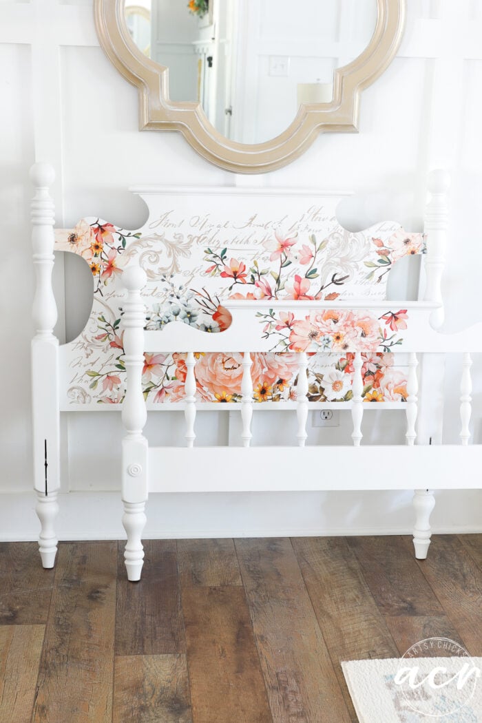 white twin headboard and footboard with white wall and gold mirror