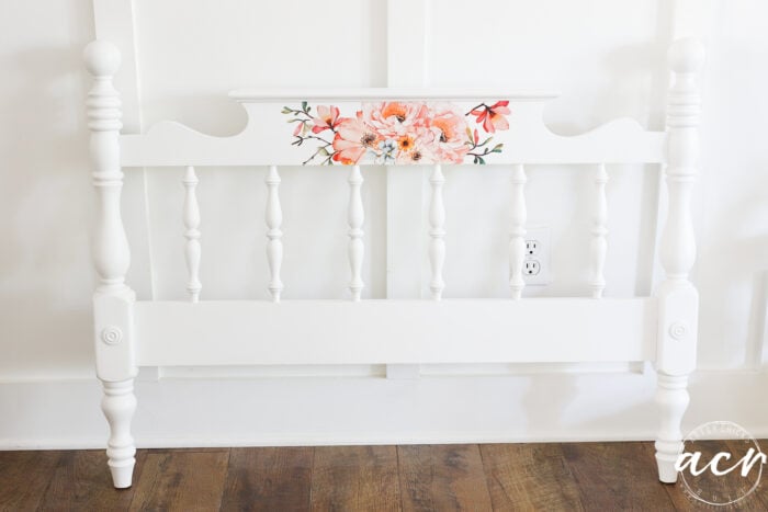 white footboard with rose colored flowers