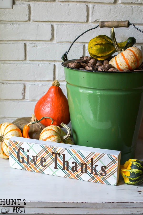 green bucket with pumpkins and give thanks sign