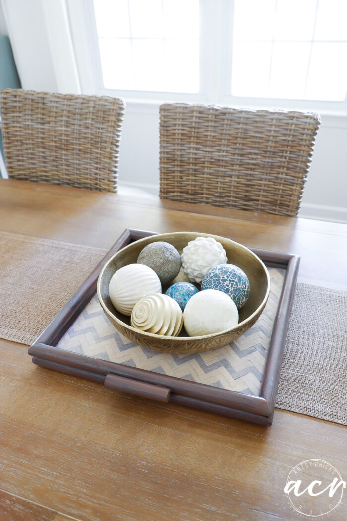 wood tray with metal bowl and decorative balls