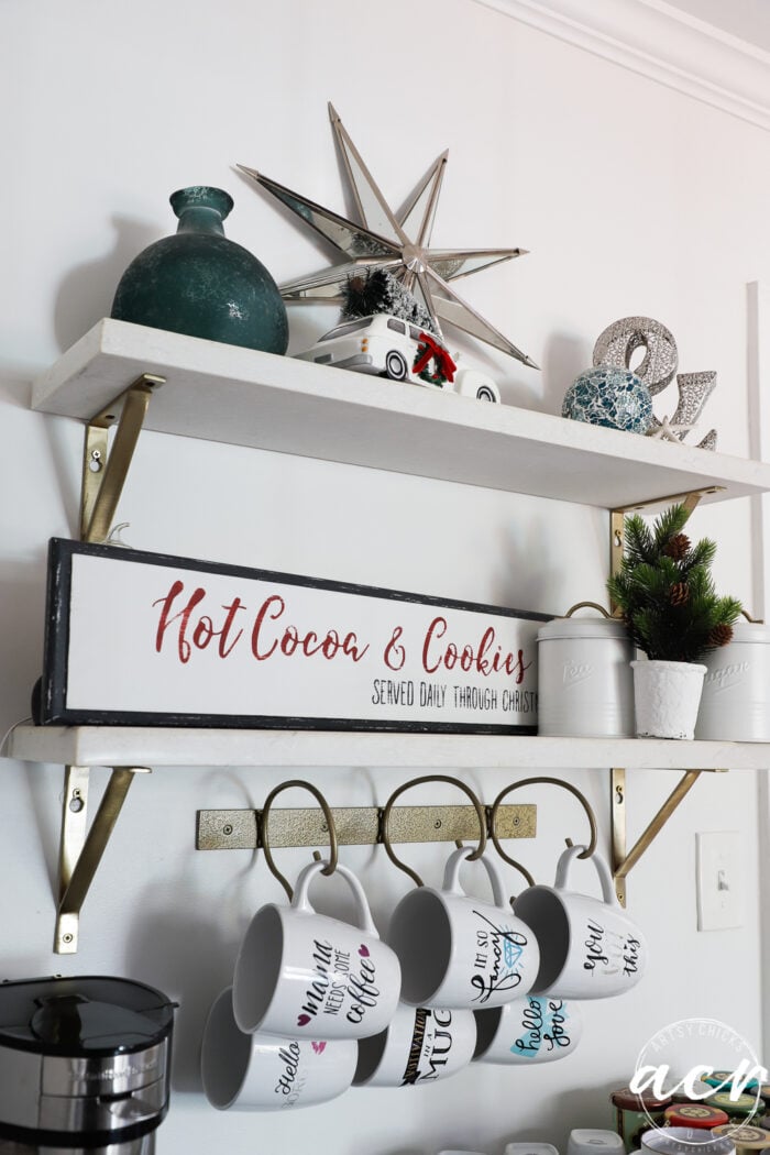 coffee bar shelves with coffee items and hot cocoa sign