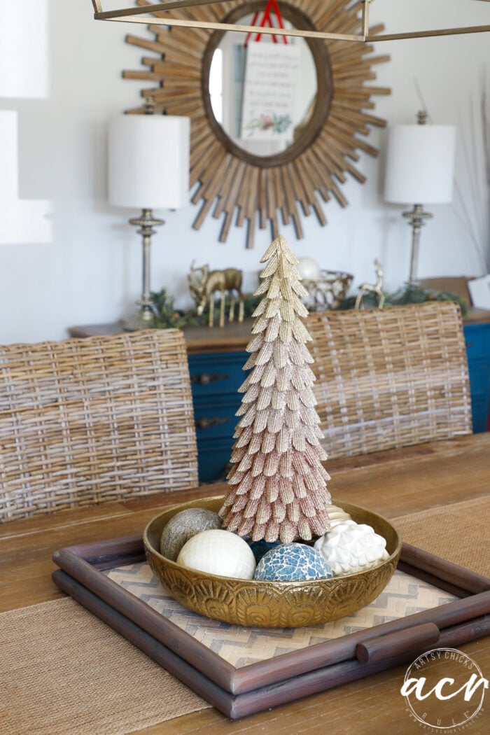 gold Christmas tree in bowl on dining room table