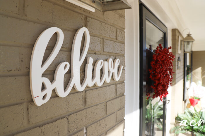 believe wood cutout on porch wall