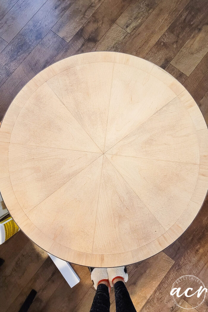 round table top with blonde colored wood sanded