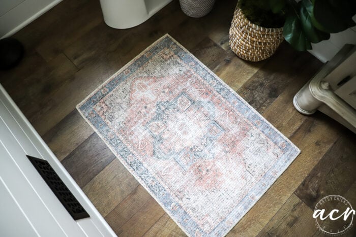 top view of small area rug with blue and coral colors