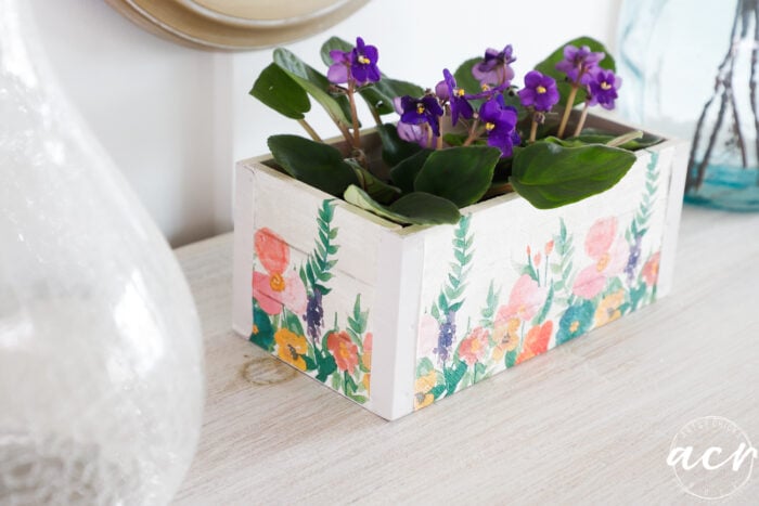 purple african violets inside floral napkin decoupage box