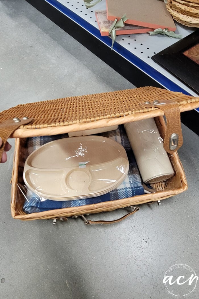 Picnic basket with blanket and plates and cups