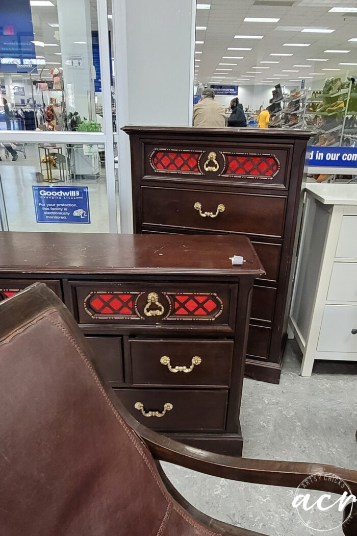 dark wood chest and dresser with criss cross bright red fabric on top drawers