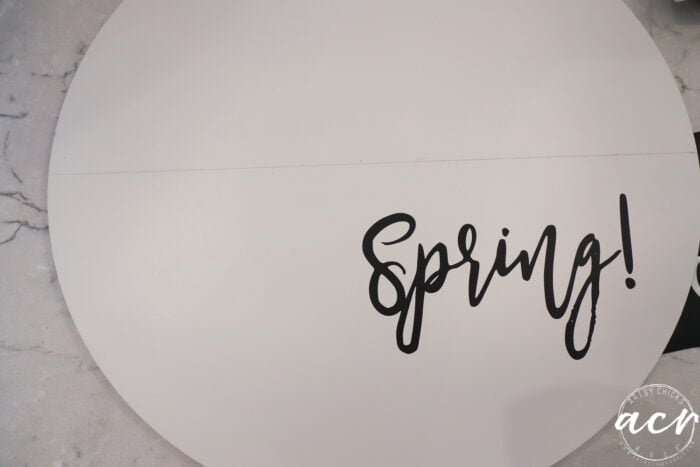 white round door hanger with spring vinyl black letters