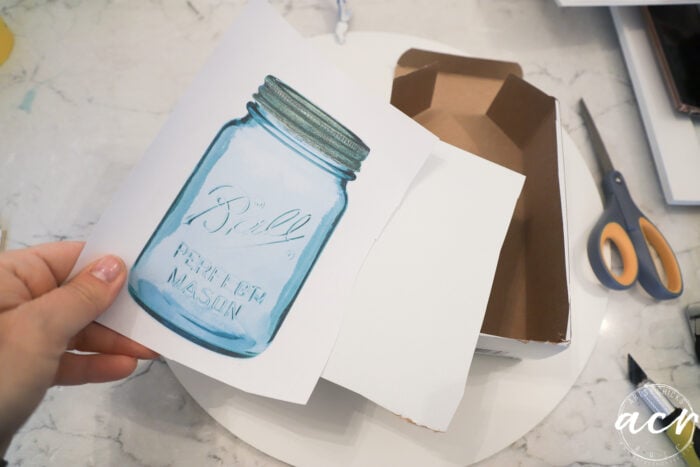 ball blue mason jar printed on paper with white boxes that've been cut
