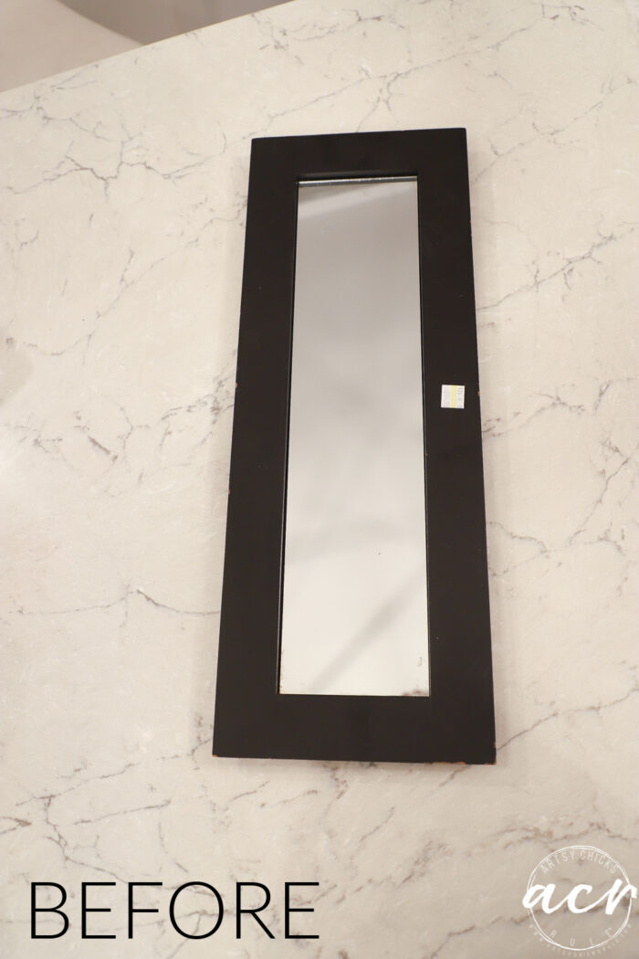 dark trim mirror tray on counter