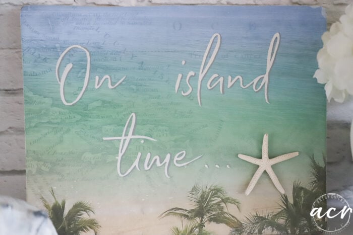 front view of on island time sign with starfish