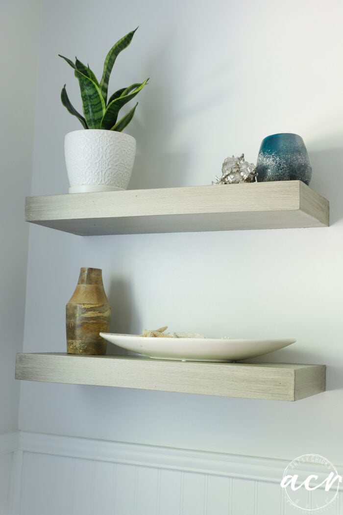 wood look shelves with plant and decor