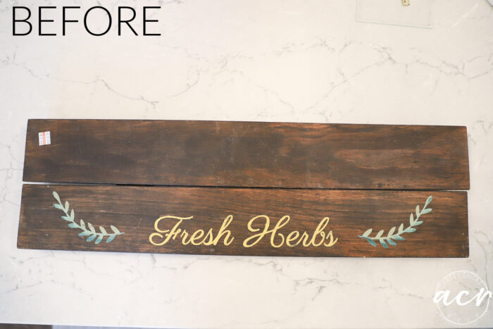 brown stained sign dated with fresh herbs