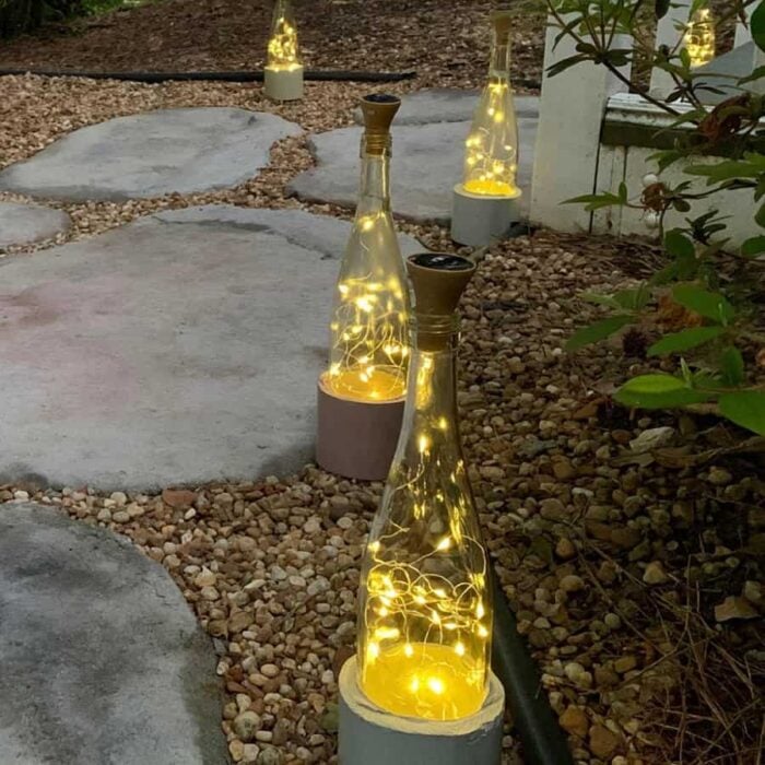 pavers with gravel and wine bottle lights