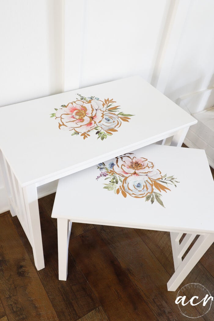 white tables with pink and blue floral transfers on top