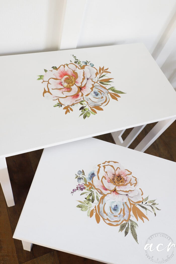 white nesting tables with pretty flower transfers on top
