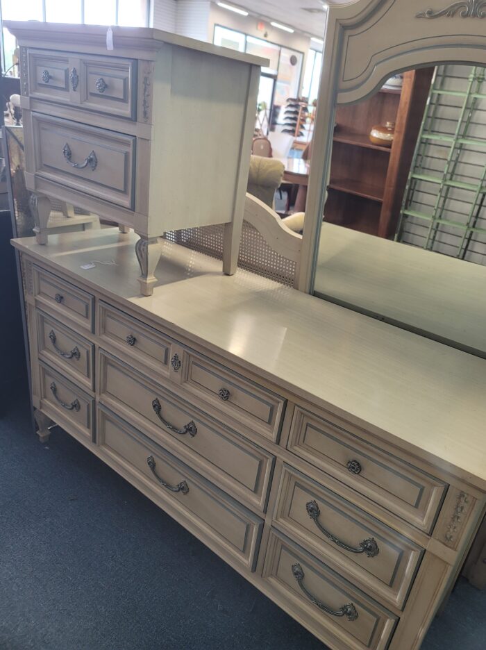 cream colored dresser and nightstand