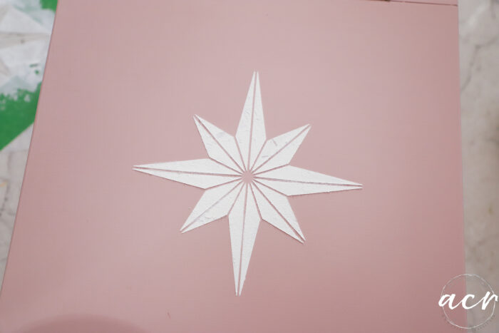 white star stencil on pink box