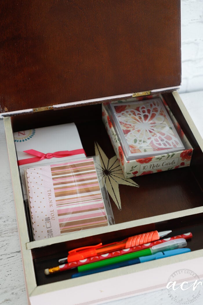 stationery and pens inside wood box