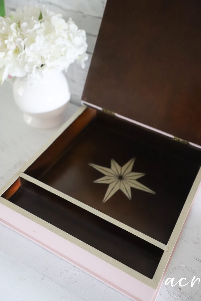 wood box interior with gold star