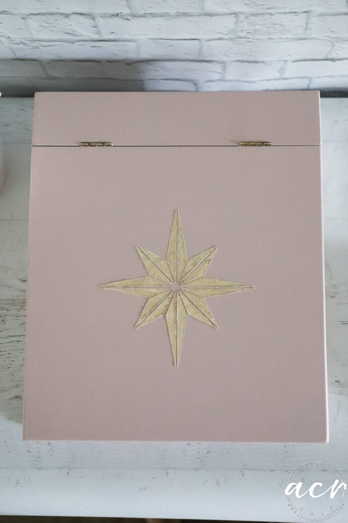top view of pink box with gold star